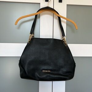 Michael Kors black shoulder bag. In excellent condition. Soft leather.